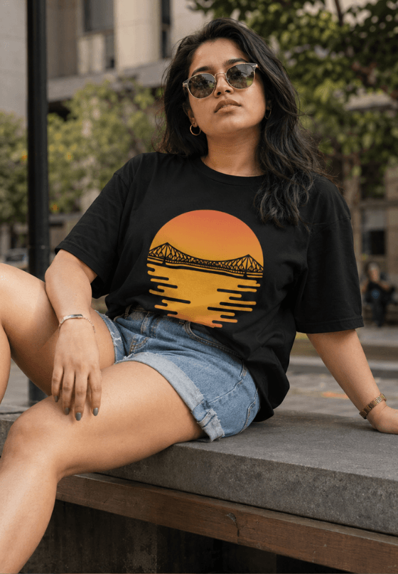 Kolkata Howrah Bridge sunset T-shirt artwork featuring a silhouette of Howrah Bridge over a glowing sunset, custom T-shirt design by Drop Drip for brands