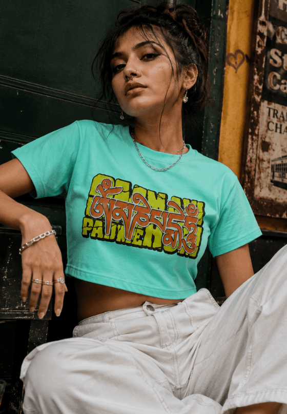 Om Mani Padme Hum typography T-shirt artwork with bold Bengali-inspired lettering, custom T-shirt design by Drop Drip for brands